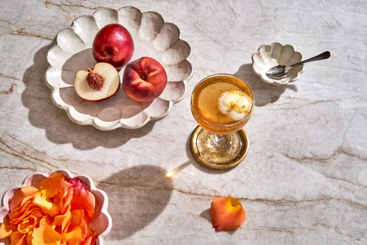a cake with fruit on top of a table
