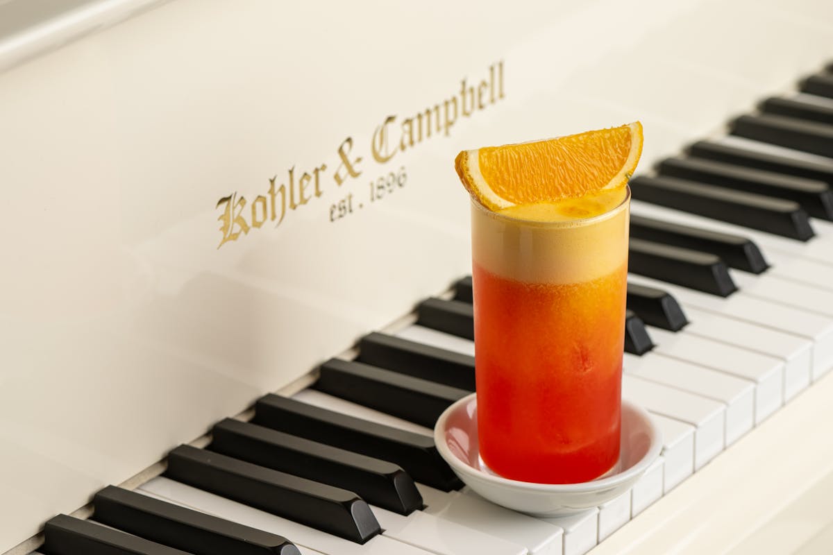 a piano keyboard and a cup of coffee