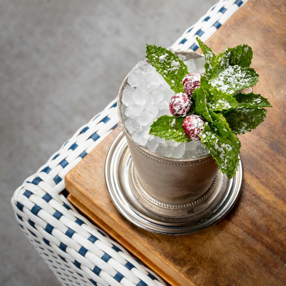 a vase filled with flowers sitting on top of a wooden table